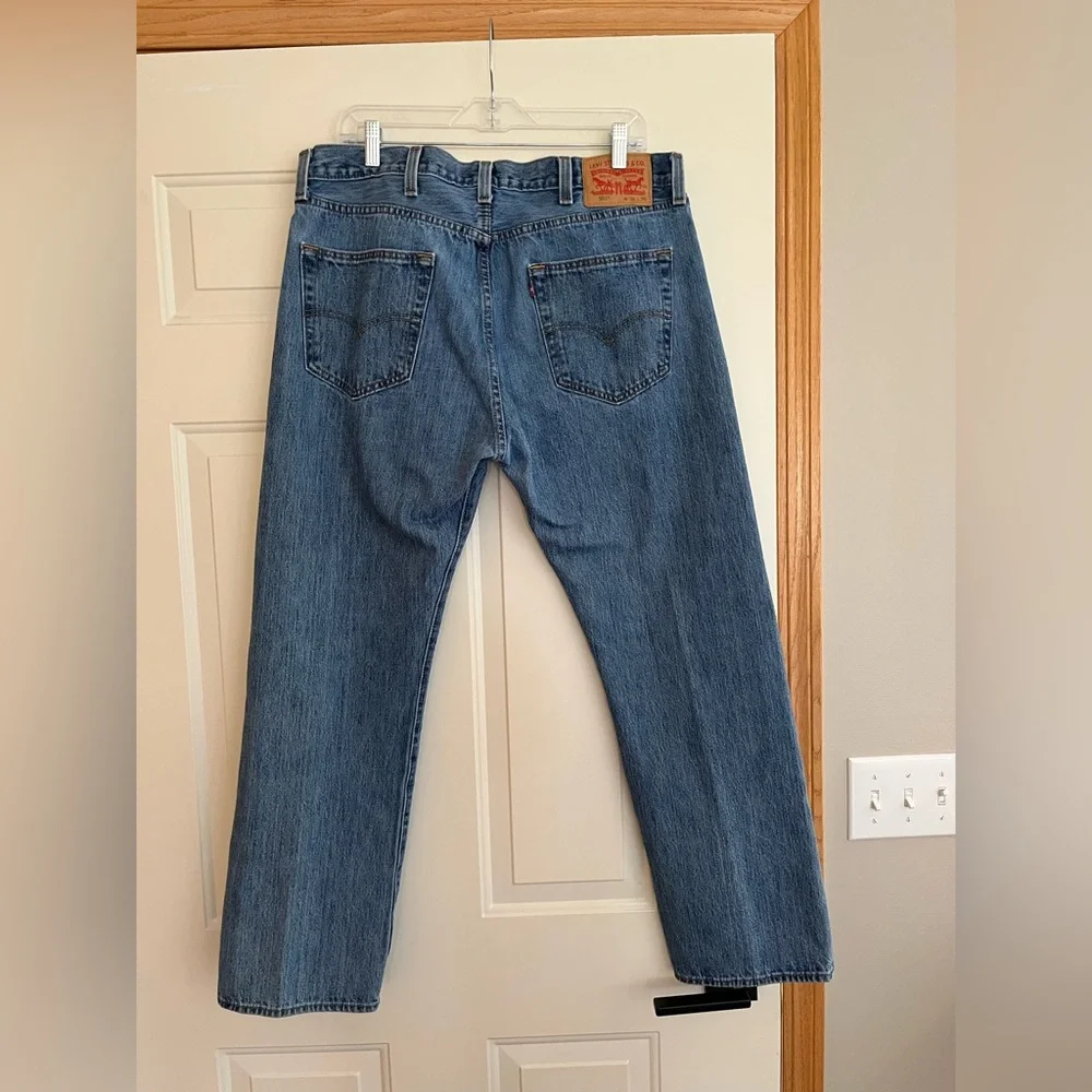 Men’s Levi’s 501 button fly medium dark wash denim jeans. Size 38x30.